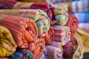 fabrics-rolled-stacked_1122-1034