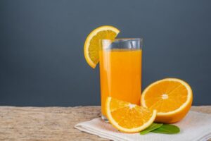 glass-orange-juice-placed-wood_1150-9666