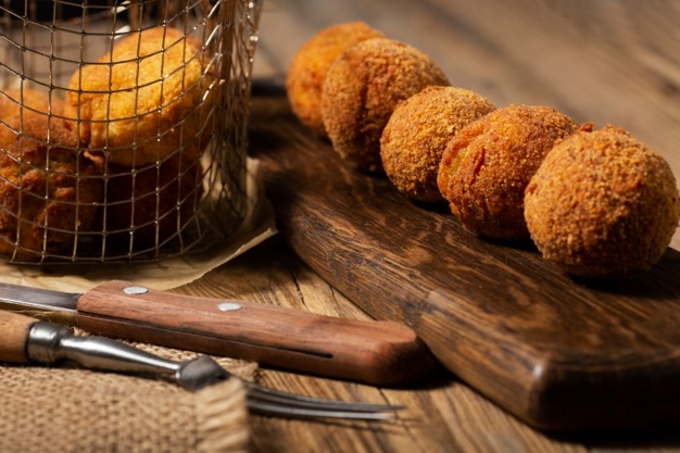 high-angle-delicious-food-croquettes_23-2149202633