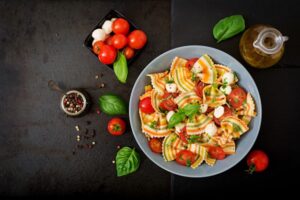 pasta-colored-farfalle-salad-with-tomatoes-mozzarella-basil_2829-14368