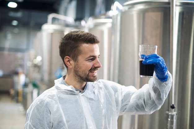 technologist-checking-product-quality-beverage-alcohol-production-plant_342744-514