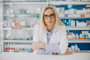 woman-working-pharmacy-wearing-coat_1303-26270